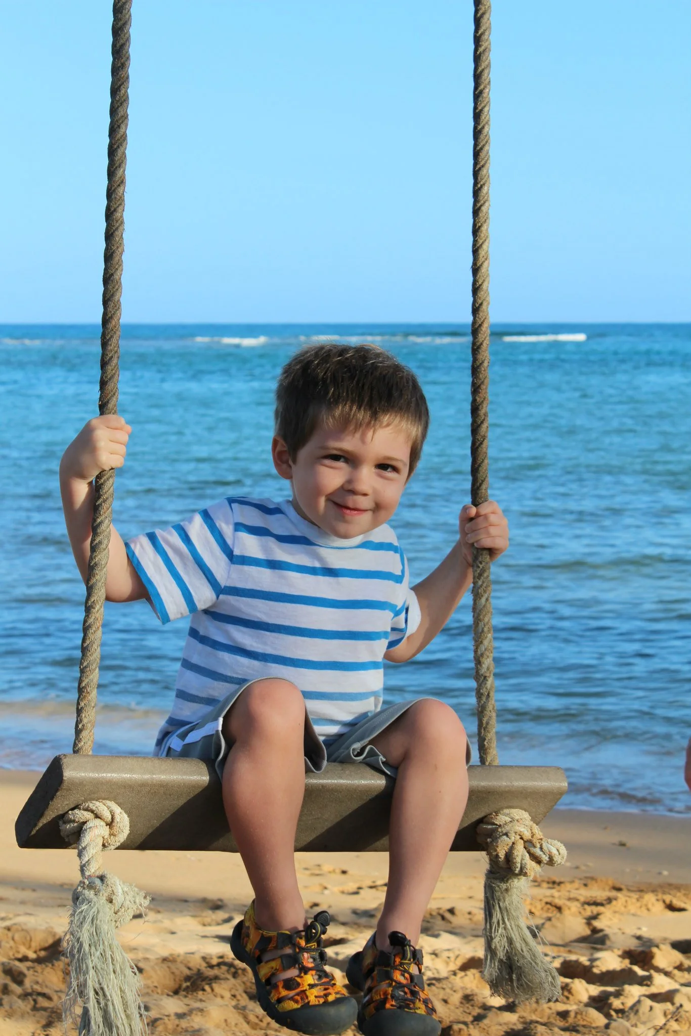 Wells swinging by the beach. 