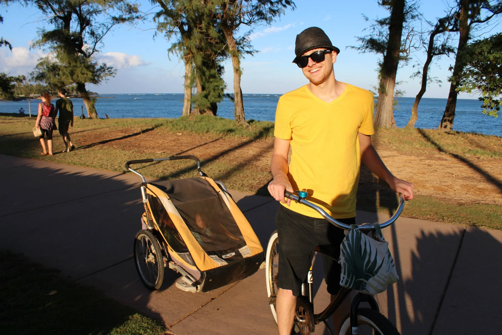 Ian with the kids in the bike trailer. 