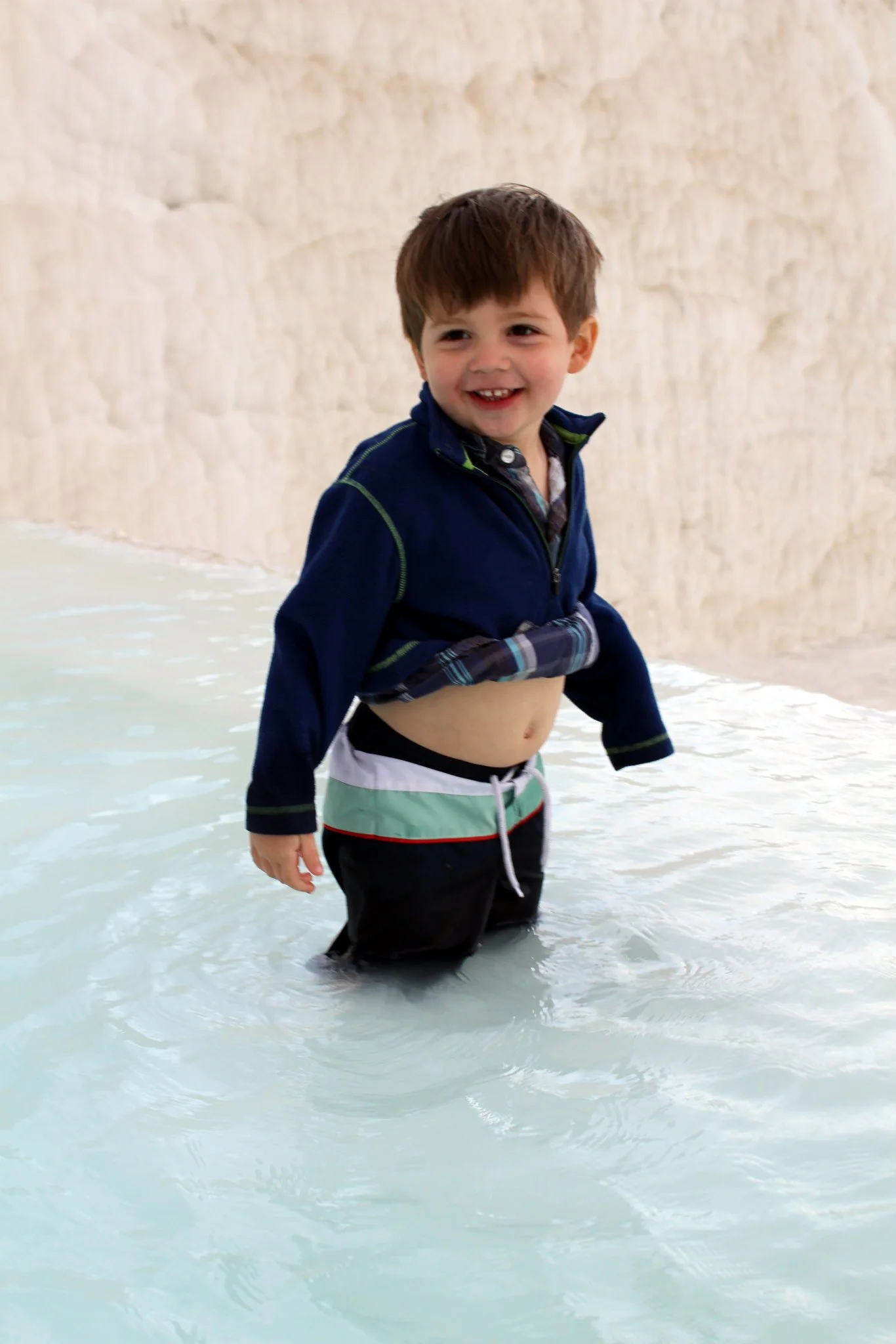 Wells feeling the warm mineral water for himself